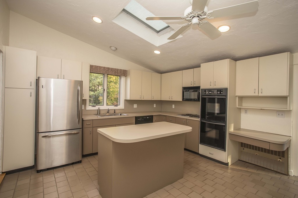 6 Marcus Road Sharon, MA 02067 - Photo 8 of 24 a kitchen with stainless steel appliances granite countertop a refrigerator a sink a stove a washer dryer and cabinets