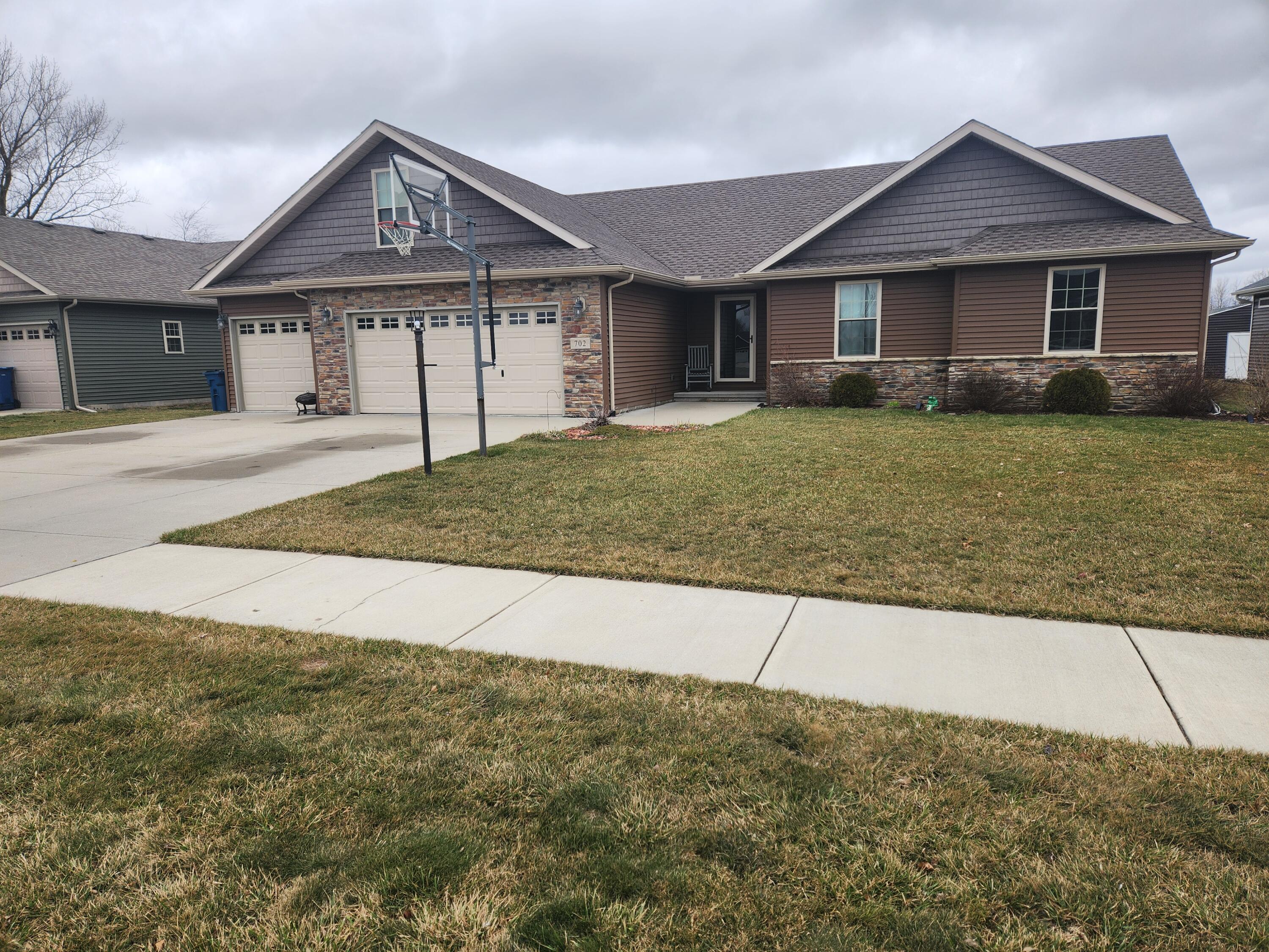 front view of a house with a yard