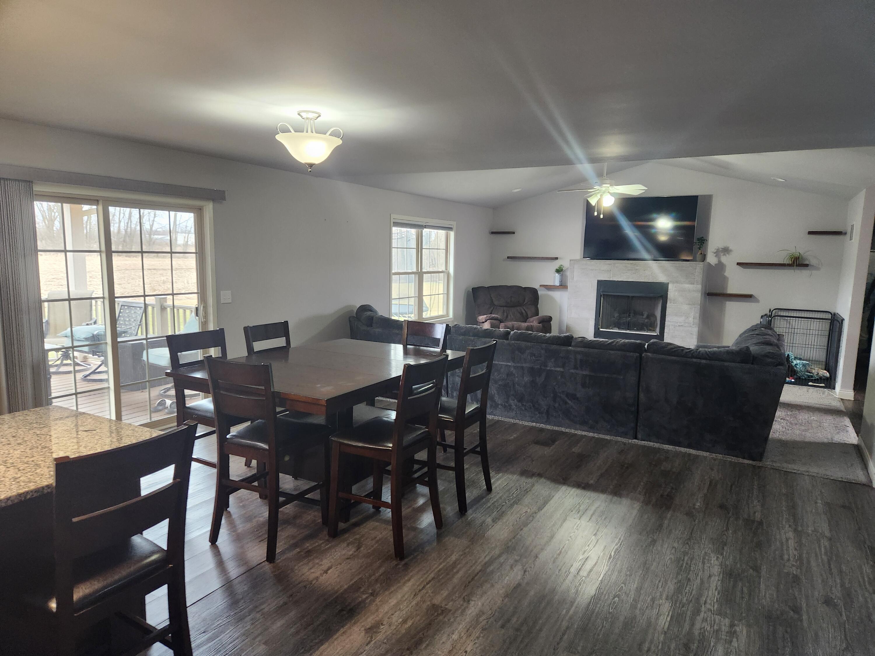 702 19th Street Southeast De Motte, IN 46310 - Photo 4 of 11 a view of a dining room with furniture window and wooden floor