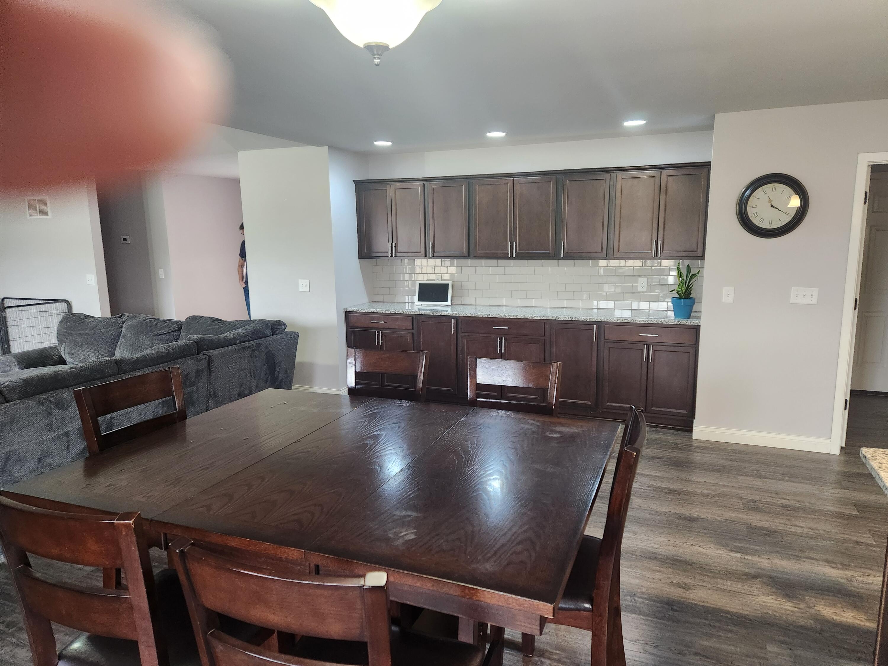 702 19th Street Southeast De Motte, IN 46310 - Photo 5 of 11 a living room with stainless steel appliances granite countertop furniture and wooden floor