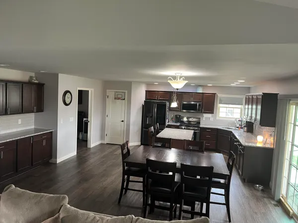 a bathroom with a granite countertop double vanity sinks and a mirror