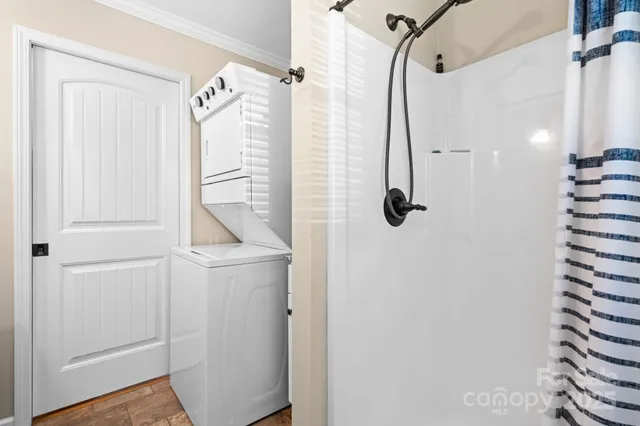 a view of house with swimming pool and outdoor seating