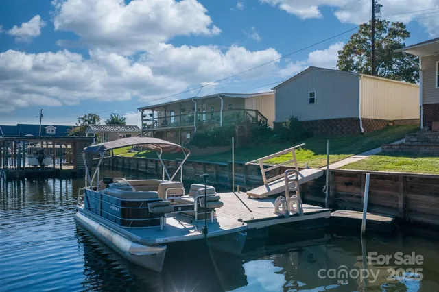 an aerial view of a house with a lake view