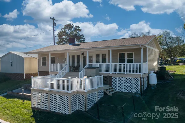 a living room with furniture a fireplace and a table