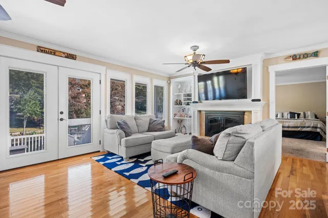 a living room with furniture fireplace and a flat screen tv