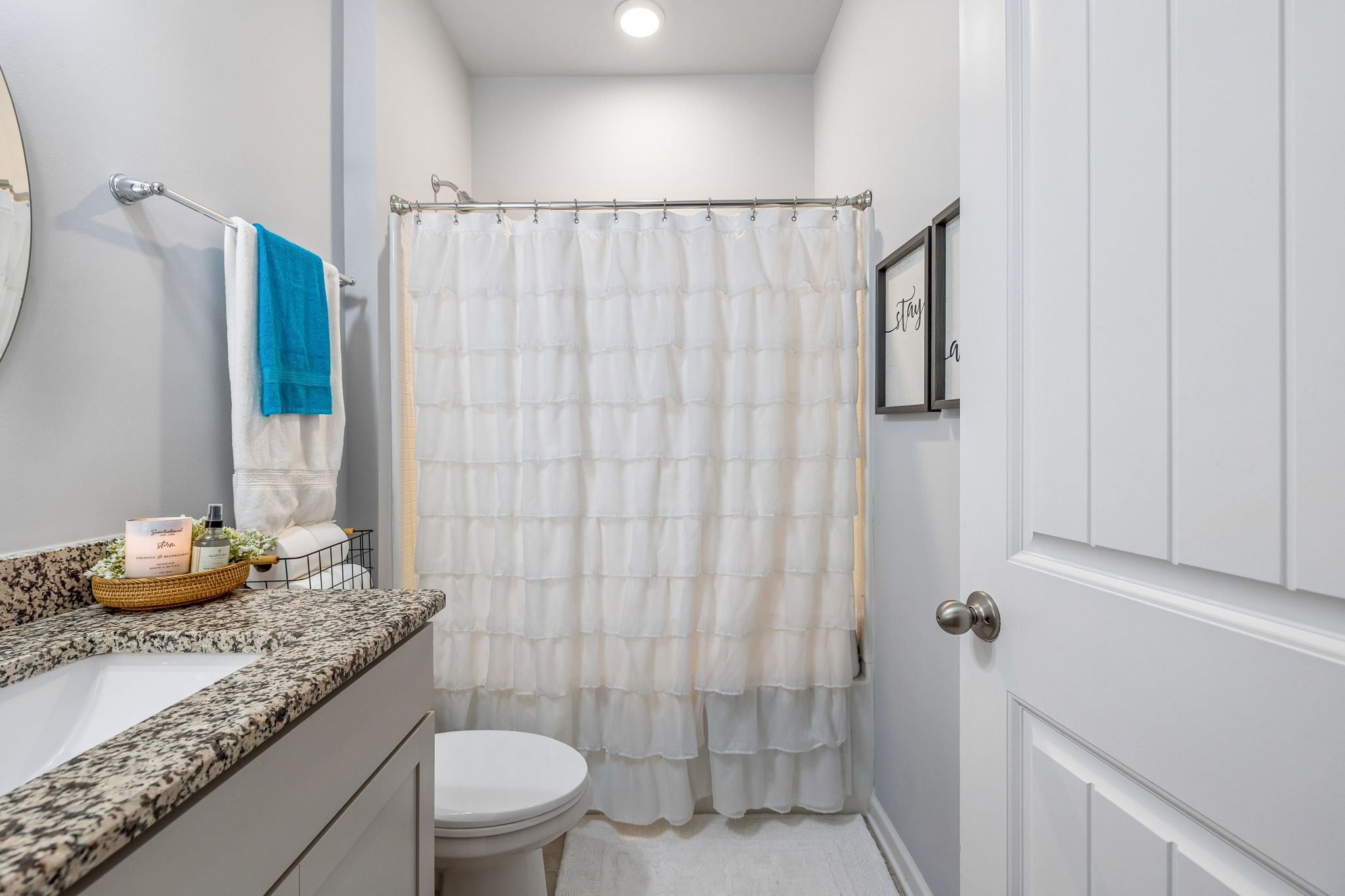 320 Manor Row Pleasant View, TN 37146 - Photo 11 of 39 a bathroom with a granite countertop sink toilet and shower