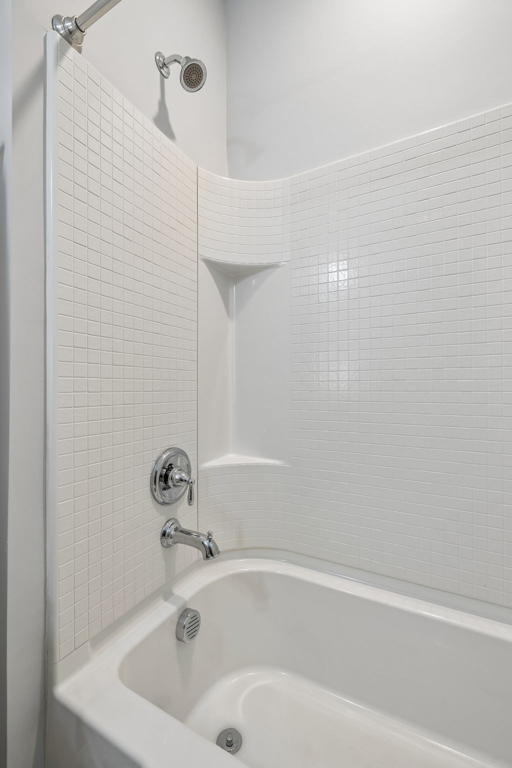320 Manor Row Pleasant View, TN 37146 - Photo 13 of 39 a white bath tub sitting next to a white sink and vanity