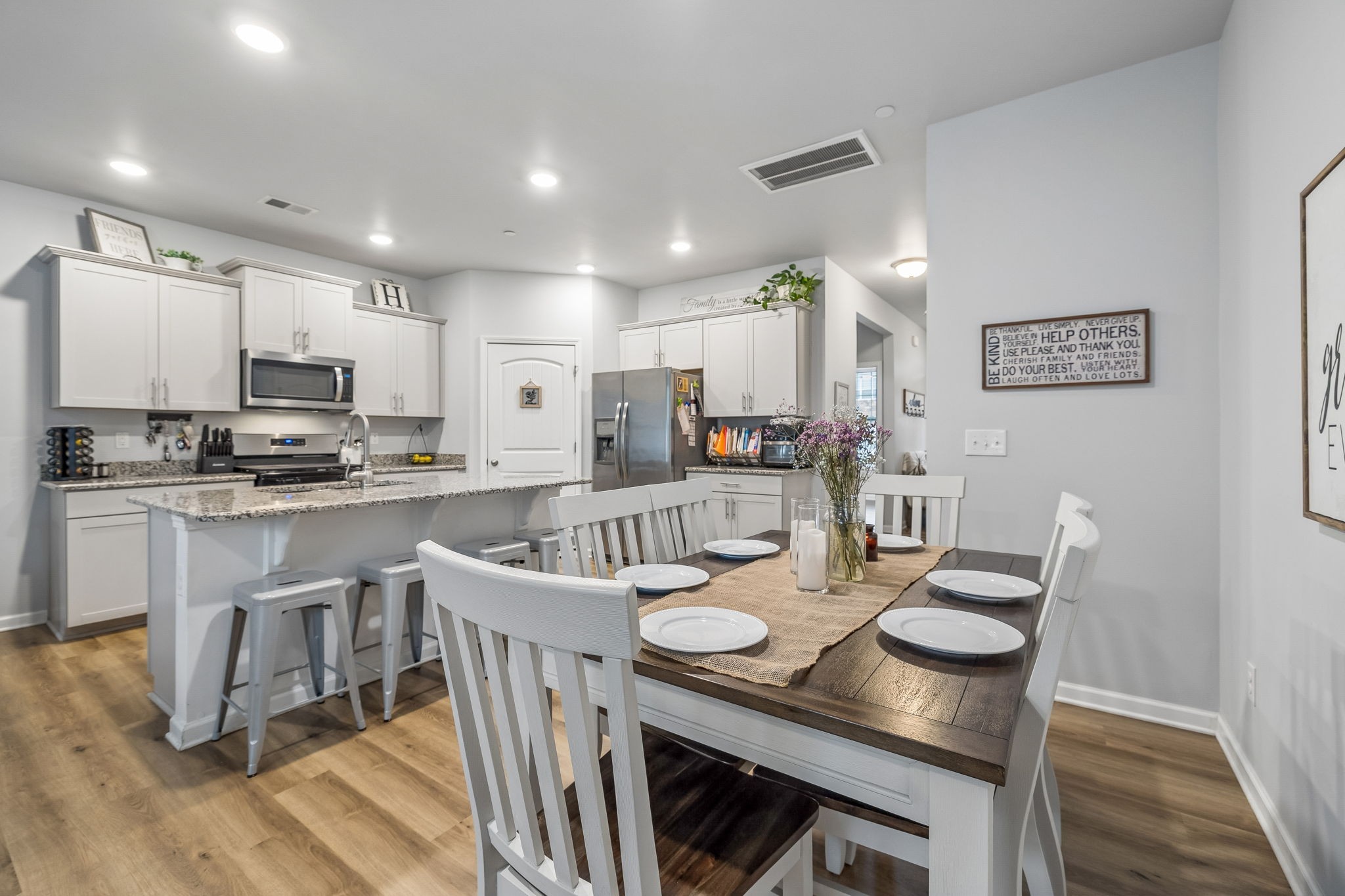 320 Manor Row Pleasant View, TN 37146 - Photo 15 of 39 a large kitchen with a table and chairs
