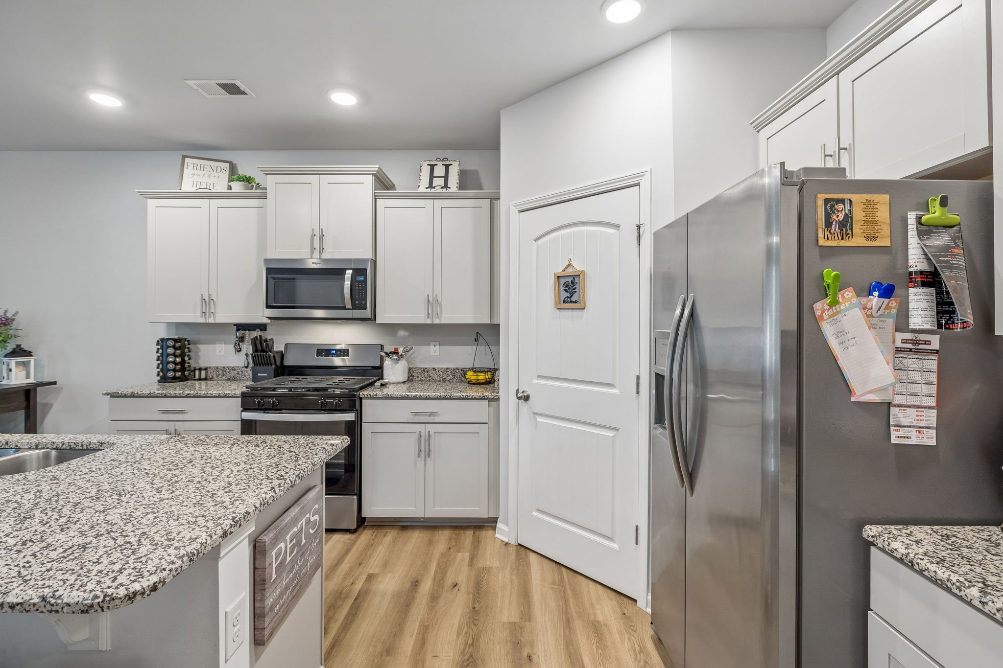 320 Manor Row Pleasant View, TN 37146 - Photo 20 of 39 a kitchen with stainless steel appliances a refrigerator sink and microwave