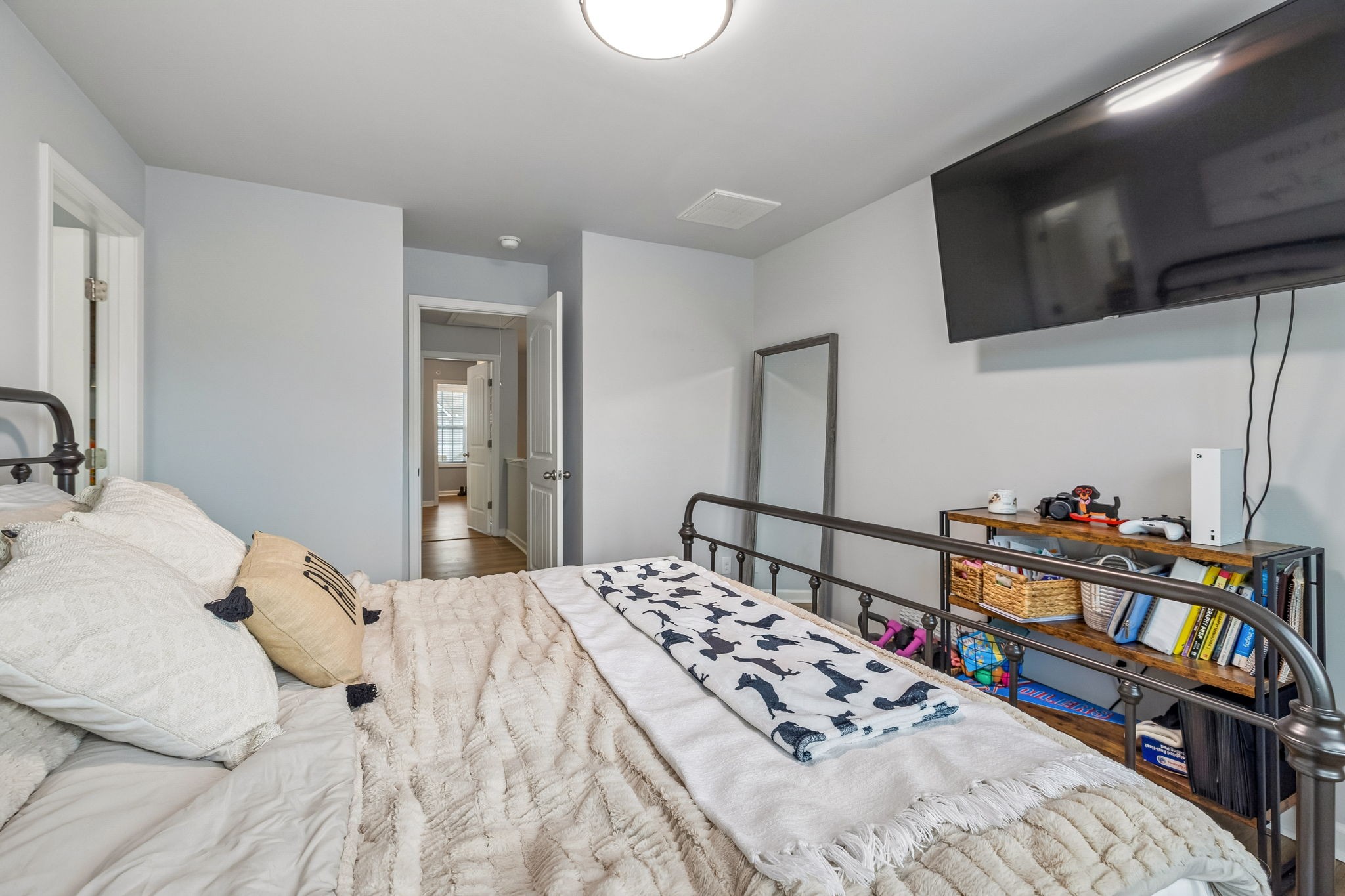 320 Manor Row Pleasant View, TN 37146 - Photo 25 of 39 a bedroom with a bed and a flat screen tv