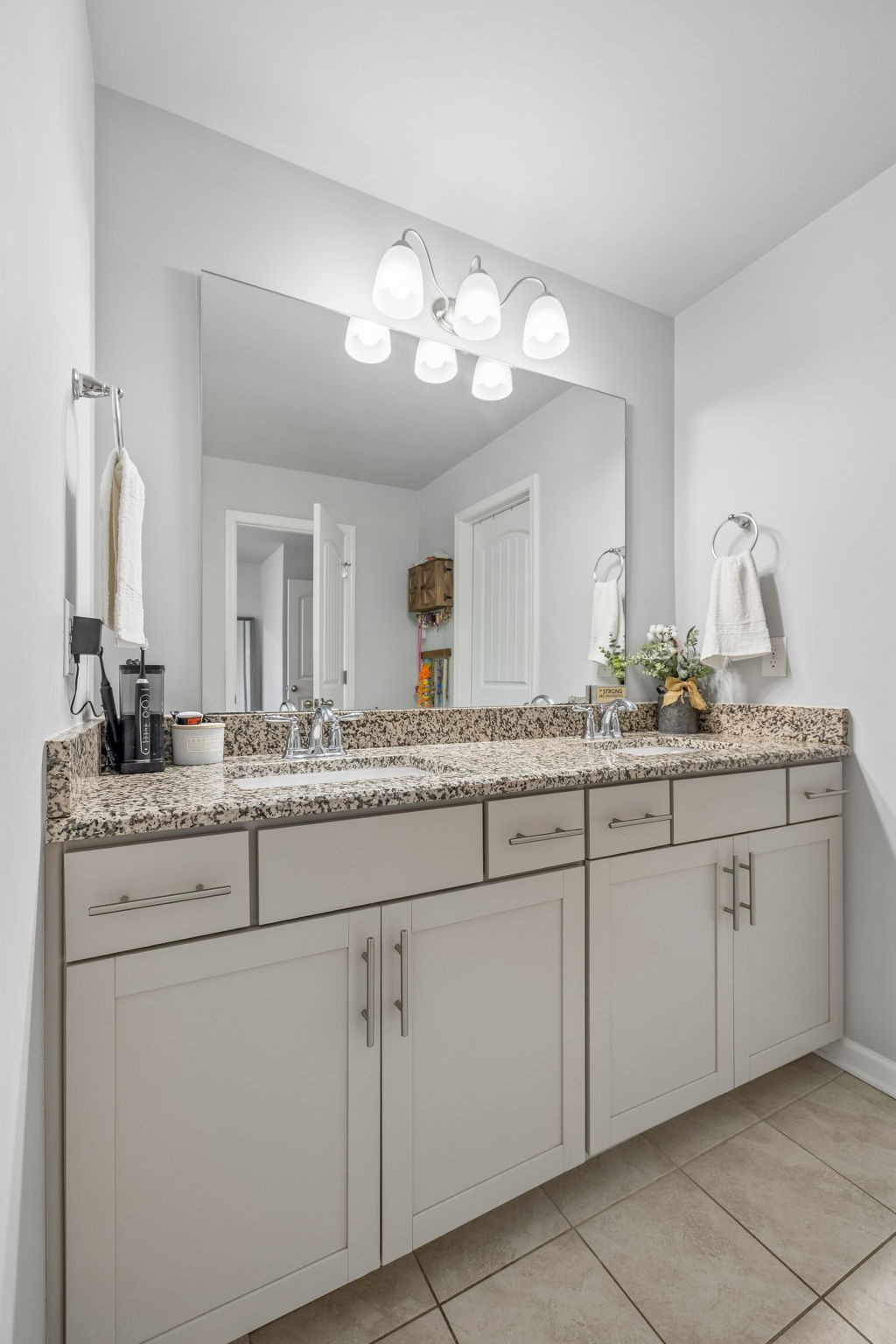 320 Manor Row Pleasant View, TN 37146 - Photo 27 of 39 a bathroom with a granite countertop double sink and a mirror