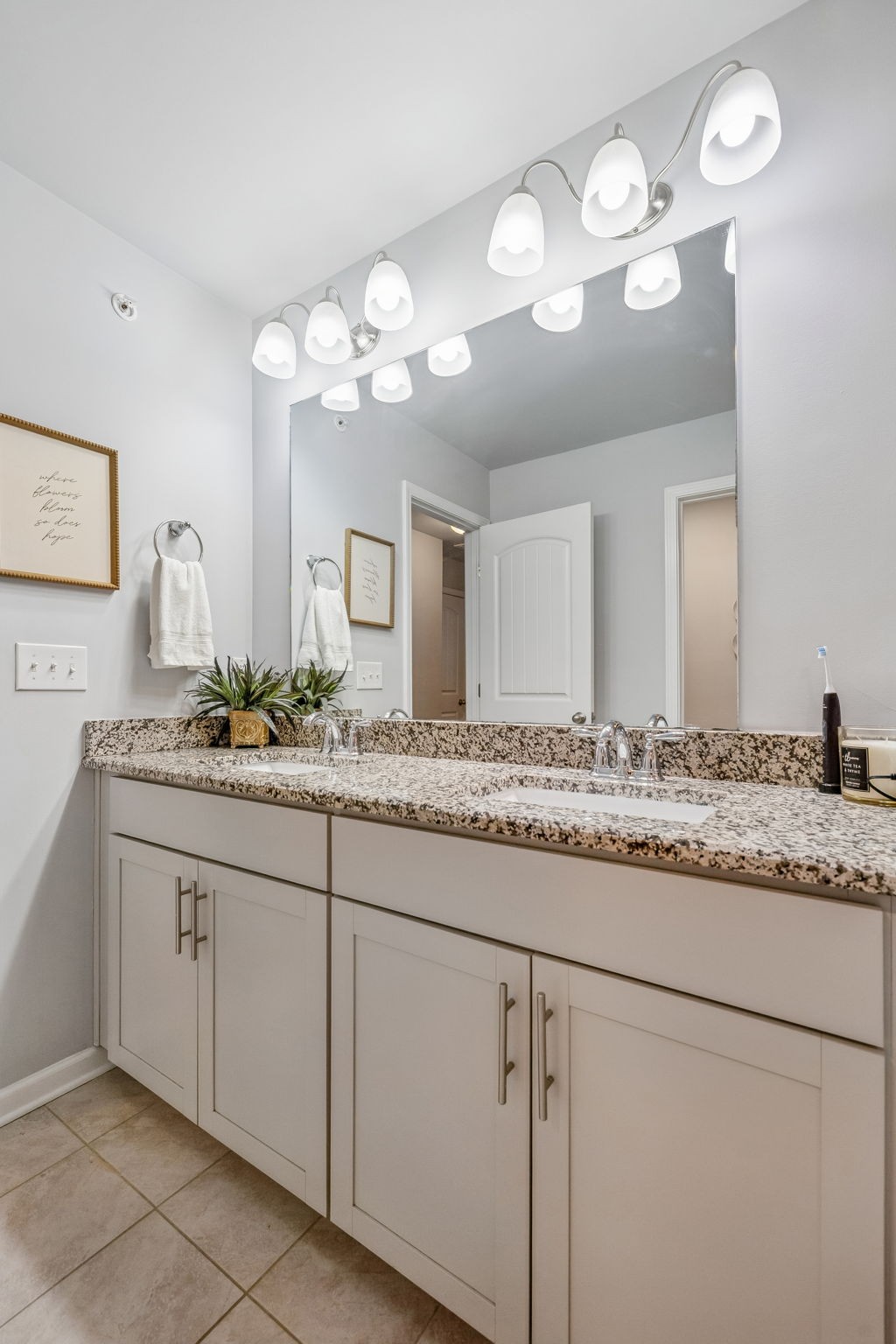 320 Manor Row Pleasant View, TN 37146 - Photo 31 of 39 a bathroom with a granite countertop double vanity and a mirror