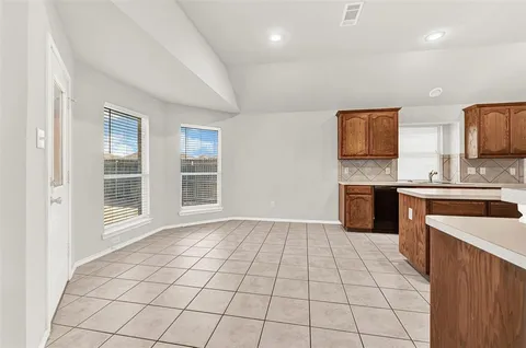 a kitchen with stainless steel appliances a sink and a stove top oven