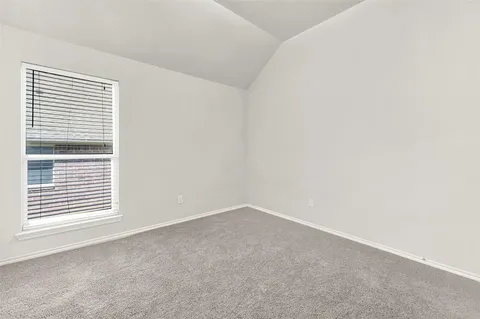 an empty room with closet area