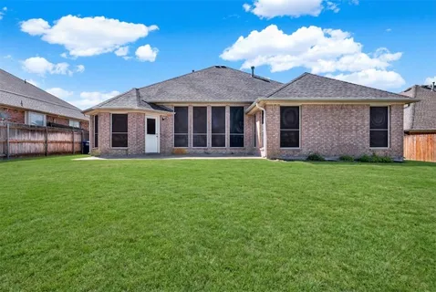 a view of a yard in front of a house with a yard