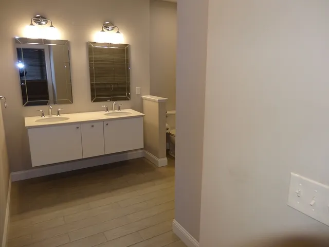 a view of bathroom with dual sinks