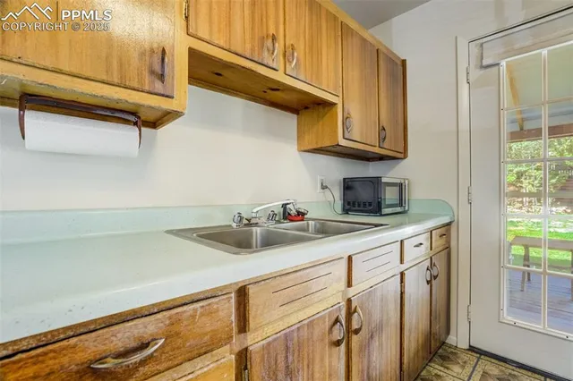 a kitchen with a stove and a refrigerator