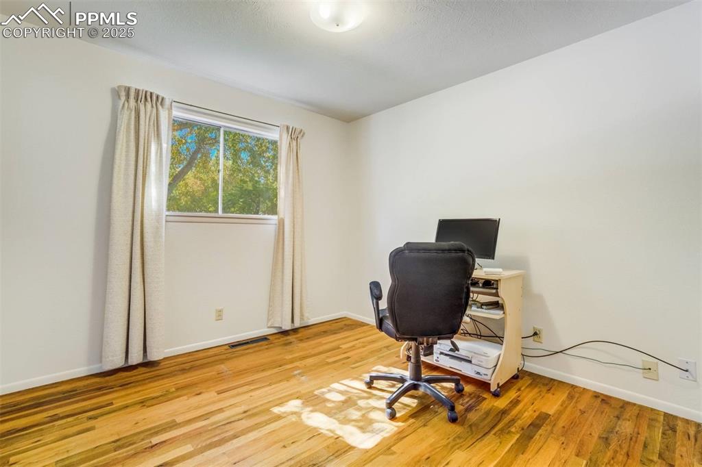 1343 Oswego Street Colorado Springs, CO 80904 - Photo 23 of 47 a view of a workspace with furniture and a window