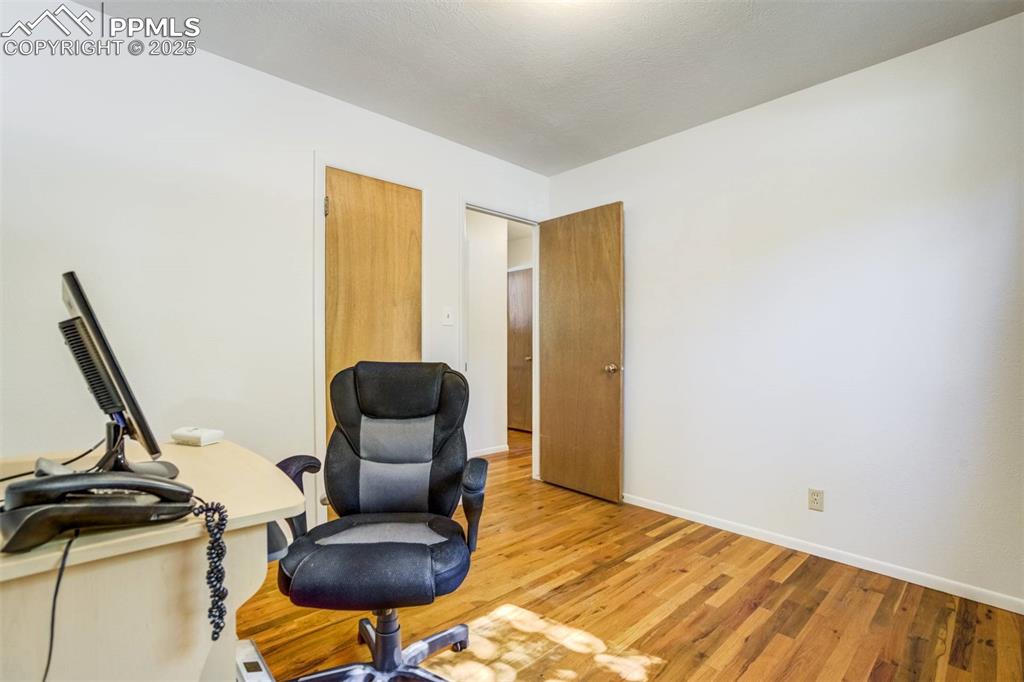 1343 Oswego Street Colorado Springs, CO 80904 - Photo 24 of 47 a view of a workspace with furniture and a window