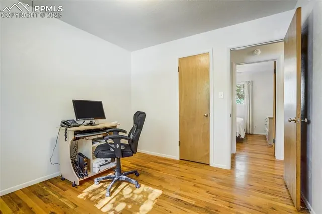 wooden floor with white walls