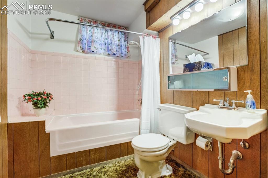 1343 Oswego Street Colorado Springs, CO 80904 - Photo 34 of 47 a bathroom with a sink toilet and shower