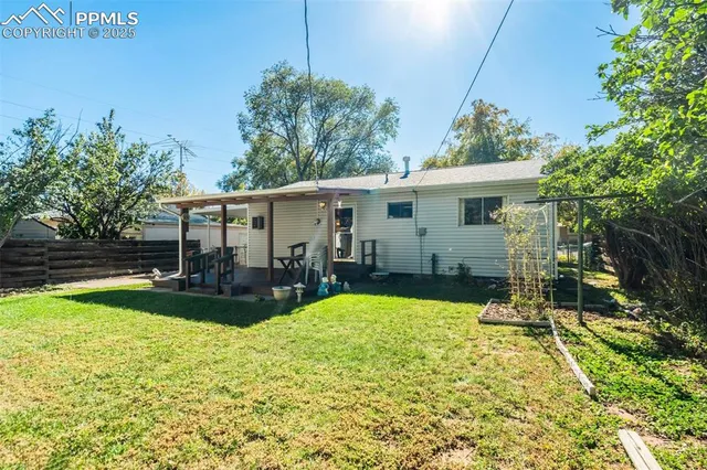 a view of backyard with a garden and plants