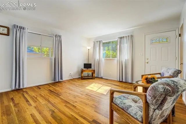 a bed room with a bed and a chair