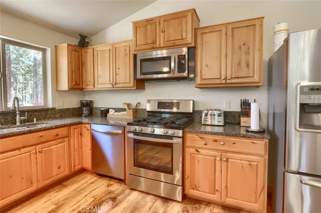 a bedroom with a bed and flat screen tv