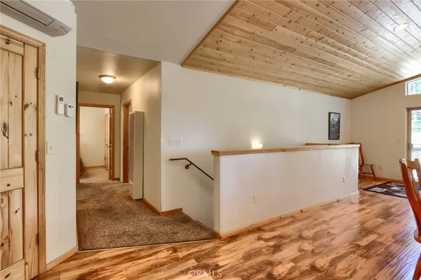 a bedroom with a rug and a chandelier