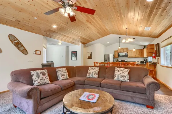 a kitchen with stainless steel appliances granite countertop a refrigerator a stove a sink and a refrigerator