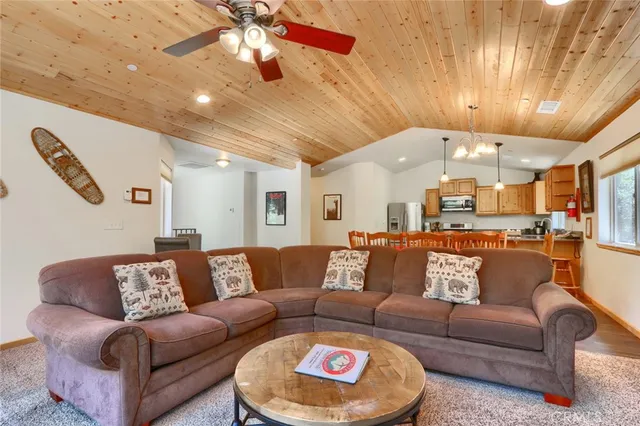 a kitchen with stainless steel appliances granite countertop a refrigerator a stove a sink and a refrigerator