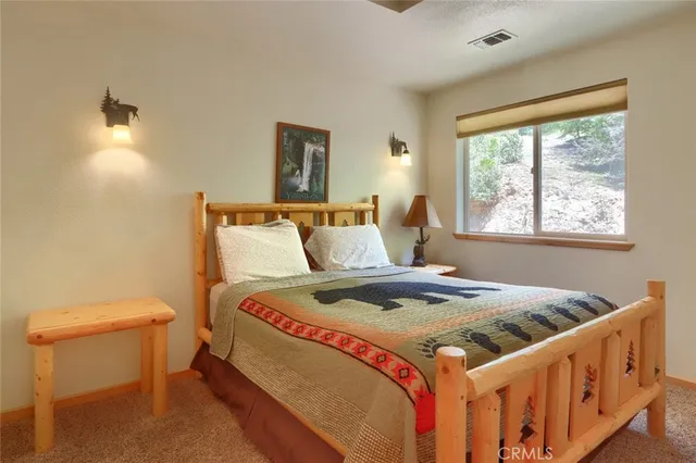 a bathroom with a toilet and shower