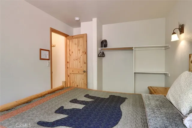 a workspace room with furniture and a window