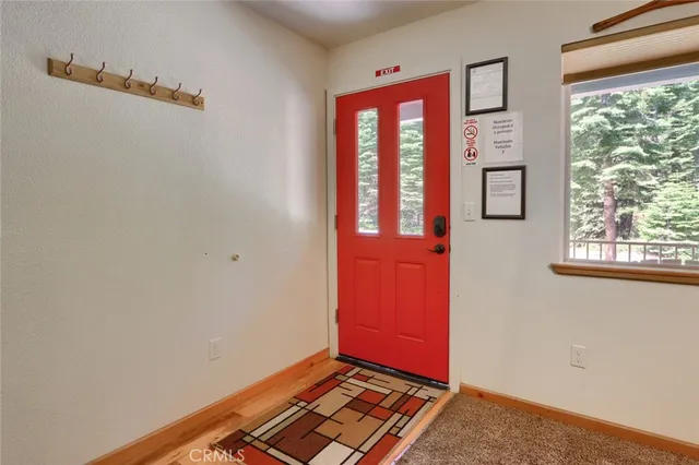a living room with furniture a ceiling fan and a flat screen tv