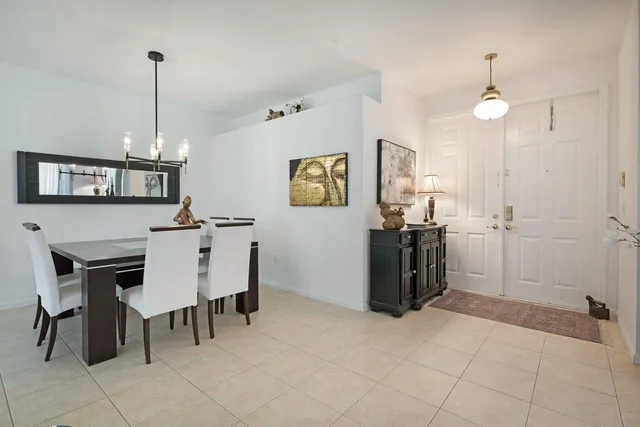 a view of kitchen with furniture and chandelier