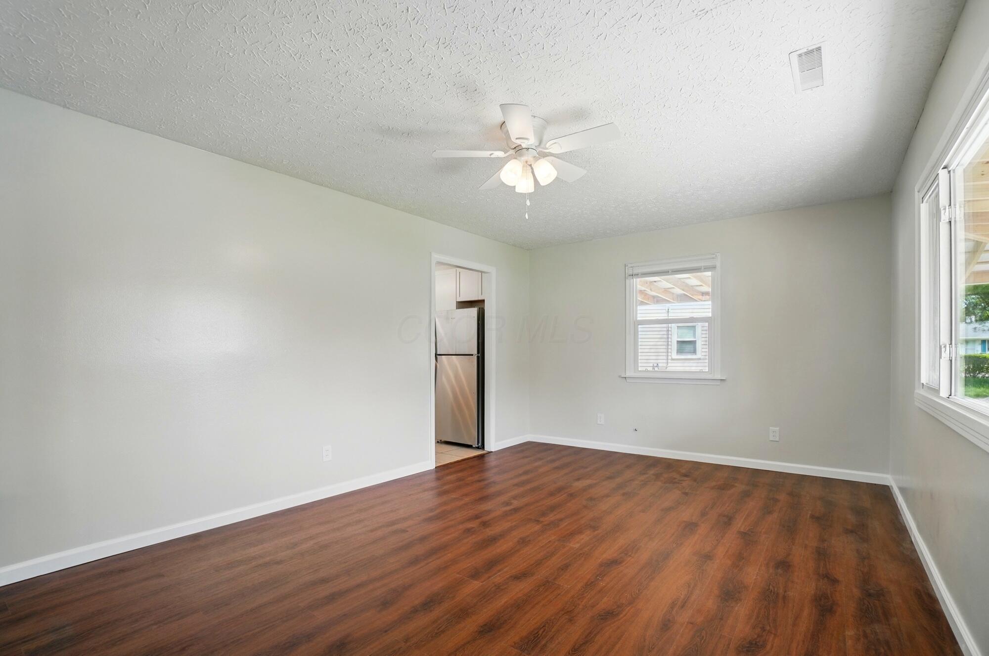 4561 St Rita Lane Columbus, OH 43213 - Photo 7 of 34 Living room doorway to kitchen