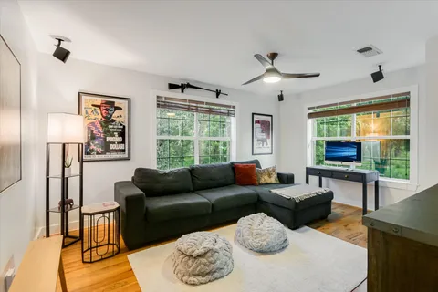 a living room with furniture and a large window