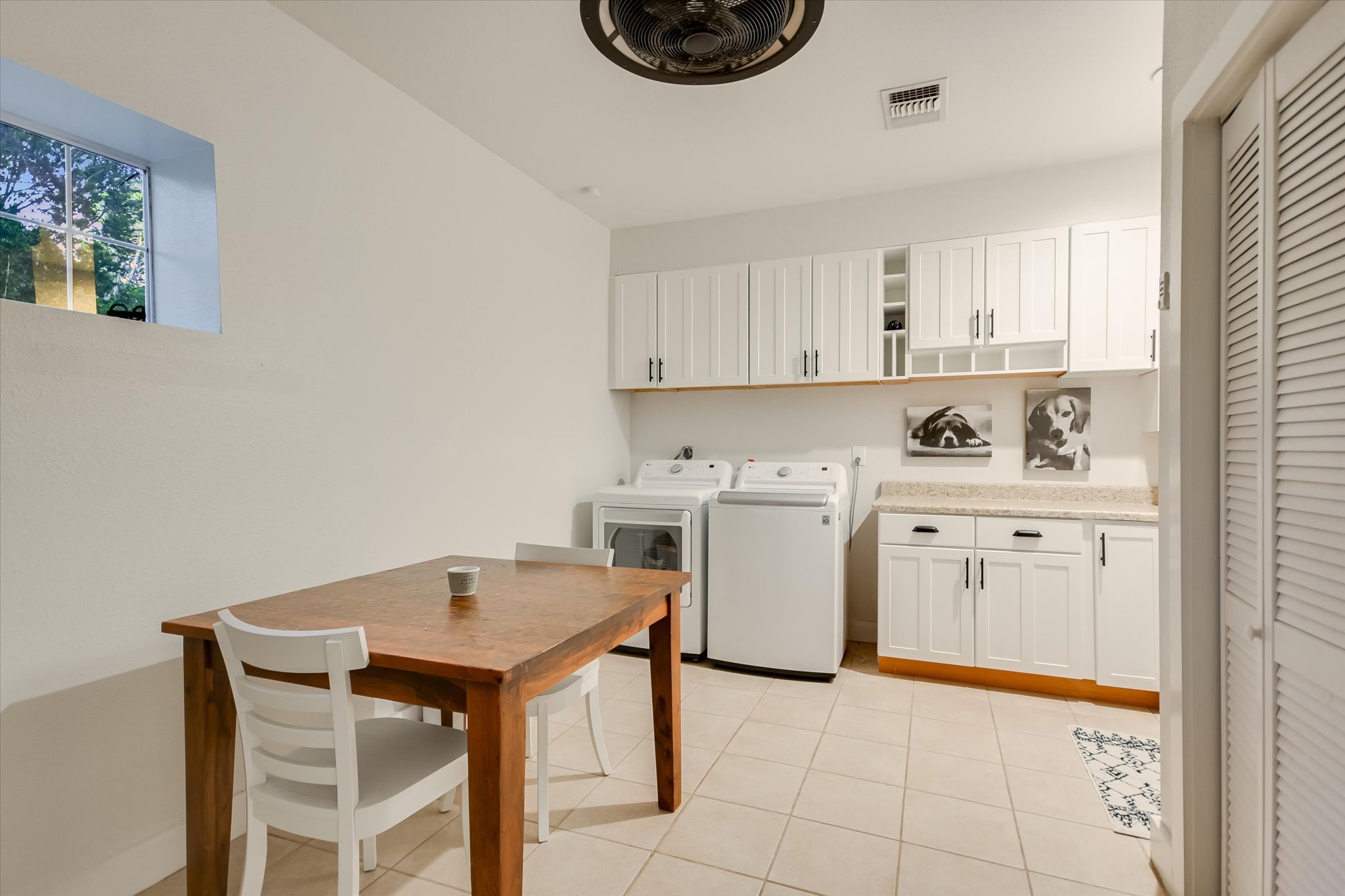 250 Hidden Oaks Road Wimberley, TX 78676 - Photo 22 of 40 a kitchen with a stove a sink cabinets and a window