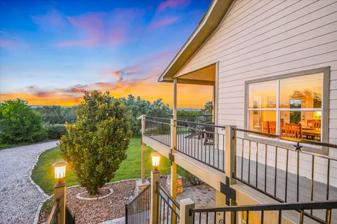 a view of a backyard with sitting area