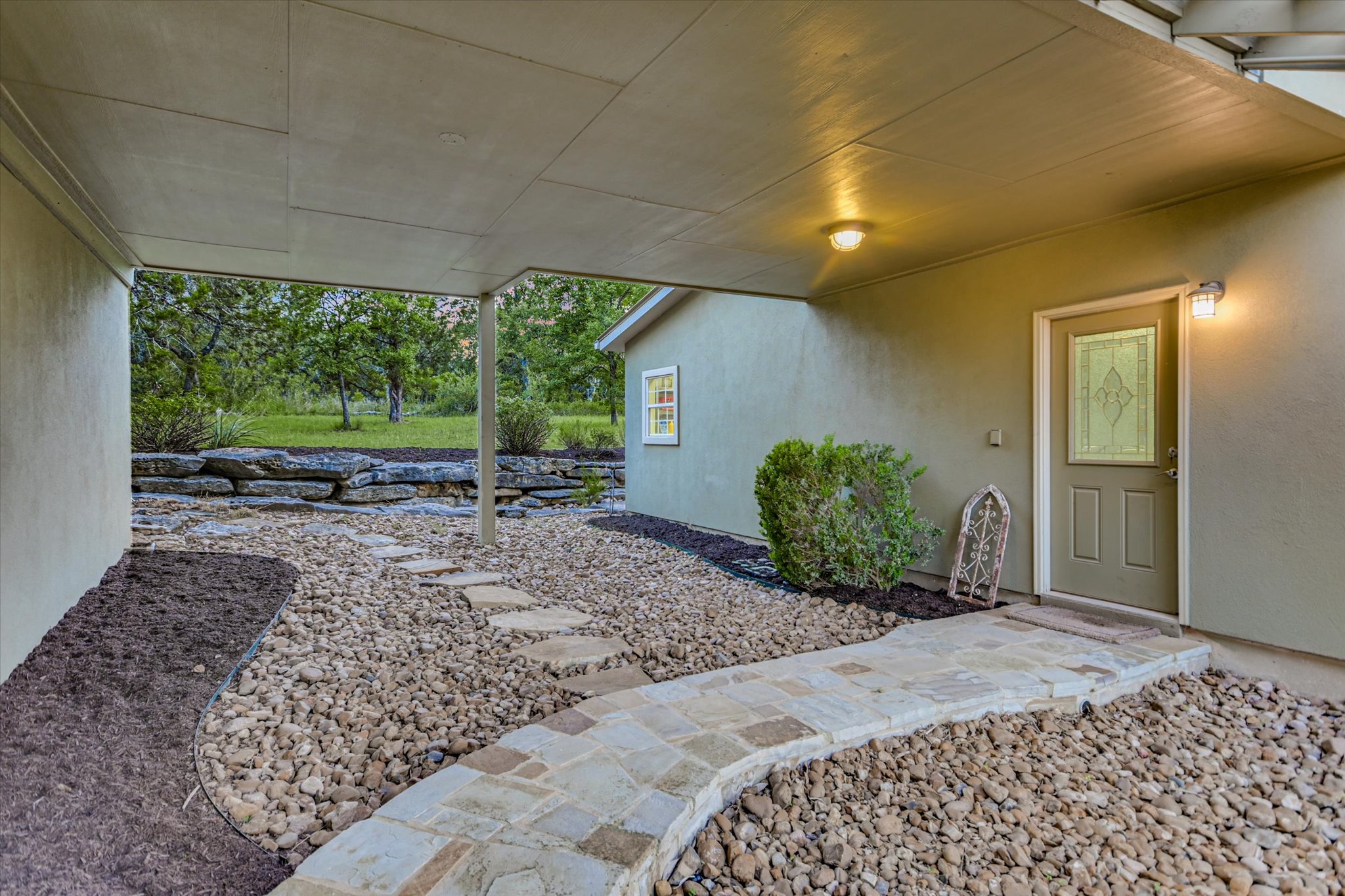 250 Hidden Oaks Road Wimberley, TX 78676 - Photo 28 of 40 a house view with a backyard space