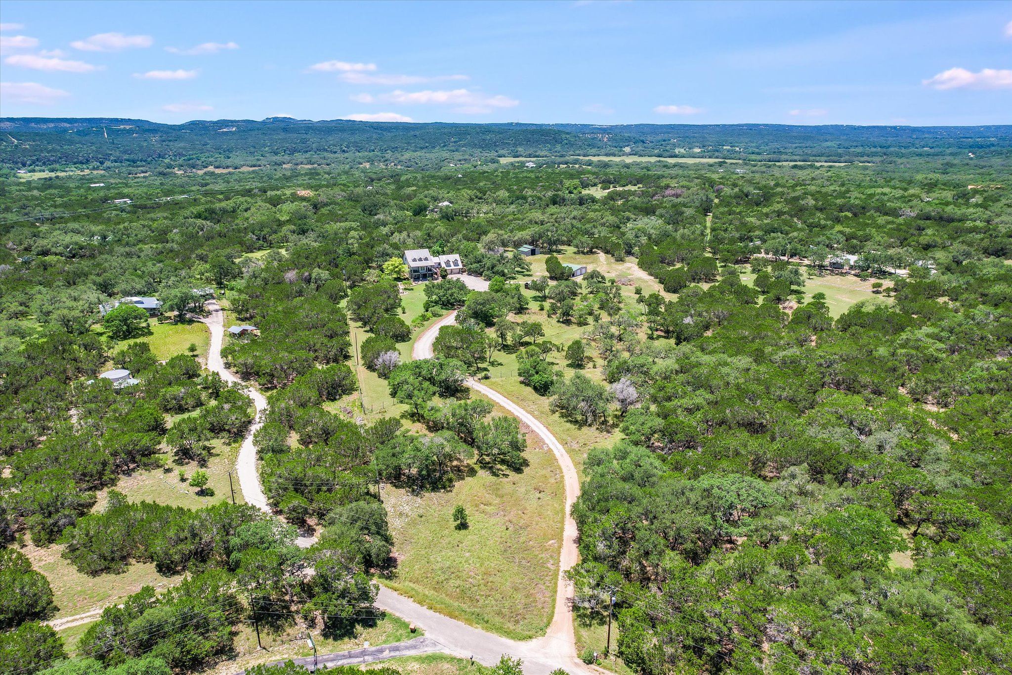 250 Hidden Oaks Road Wimberley, TX 78676 - Photo 35 of 40 a view of a big yard with lots of trees