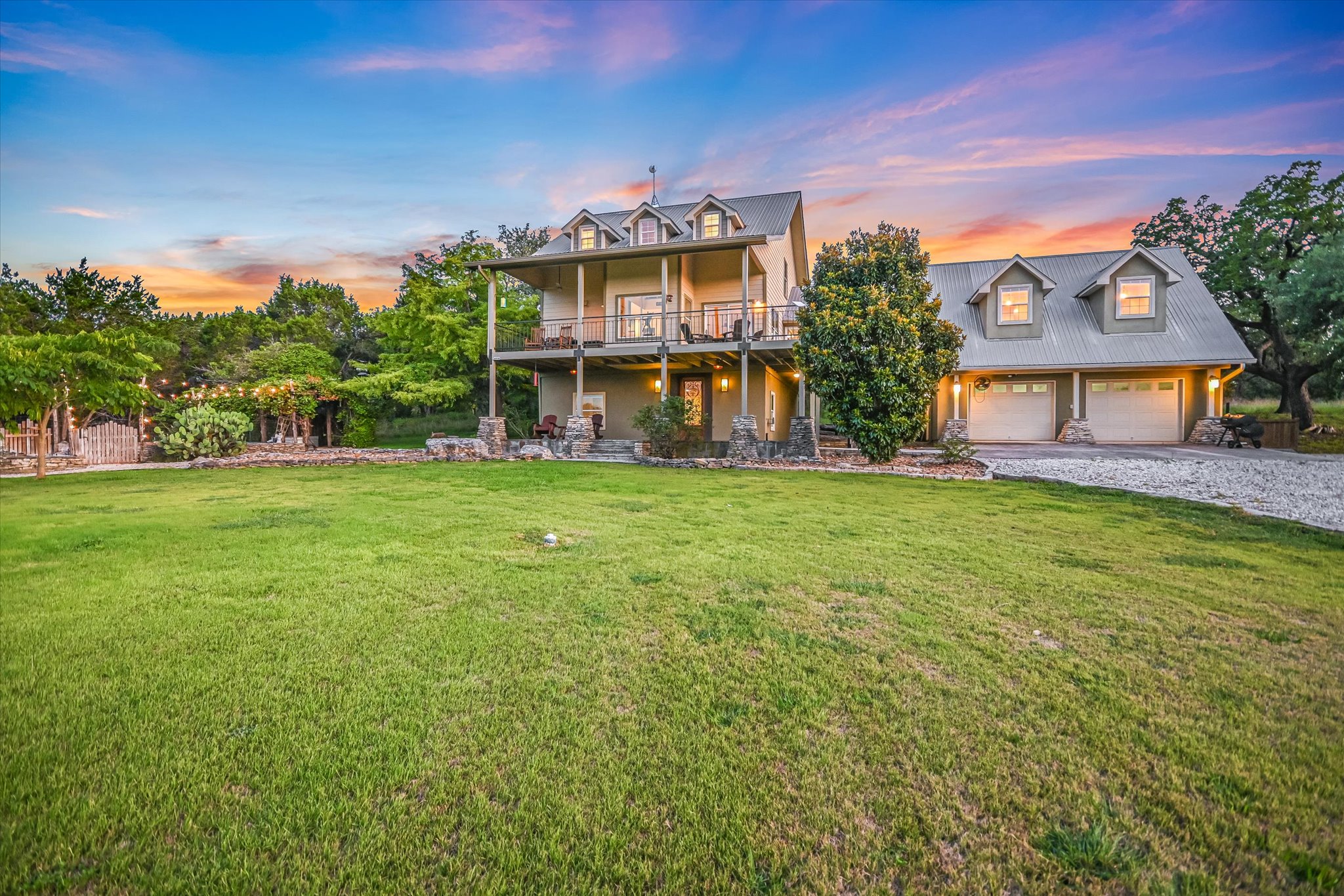 250 Hidden Oaks Road Wimberley, TX 78676 - Photo 4 of 40 front view of a house with a big yard