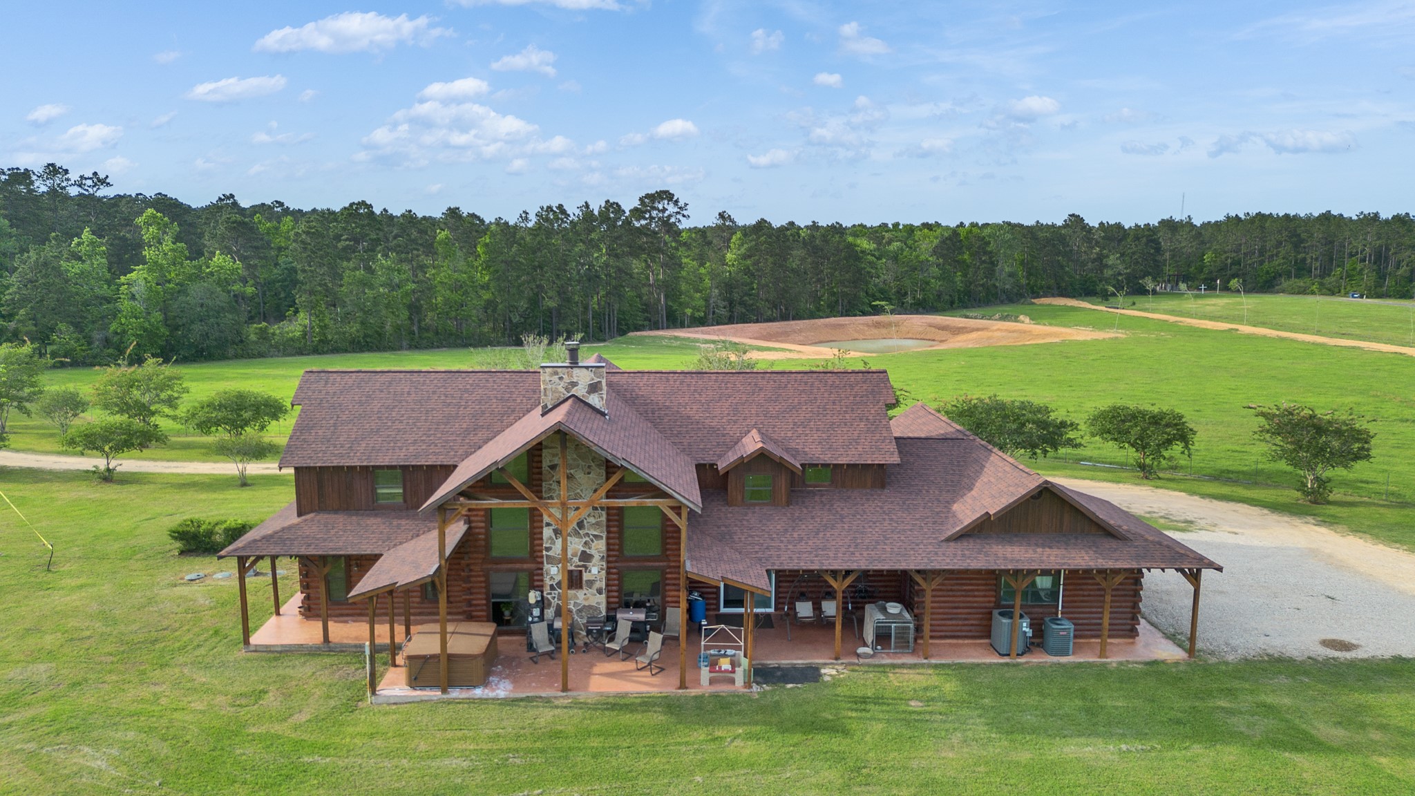 325 Forest Service 217 Road Shepherd, TX 77371 - Photo 6 of 46 an aerial view of a house with swimming pool garden and outdoor seating