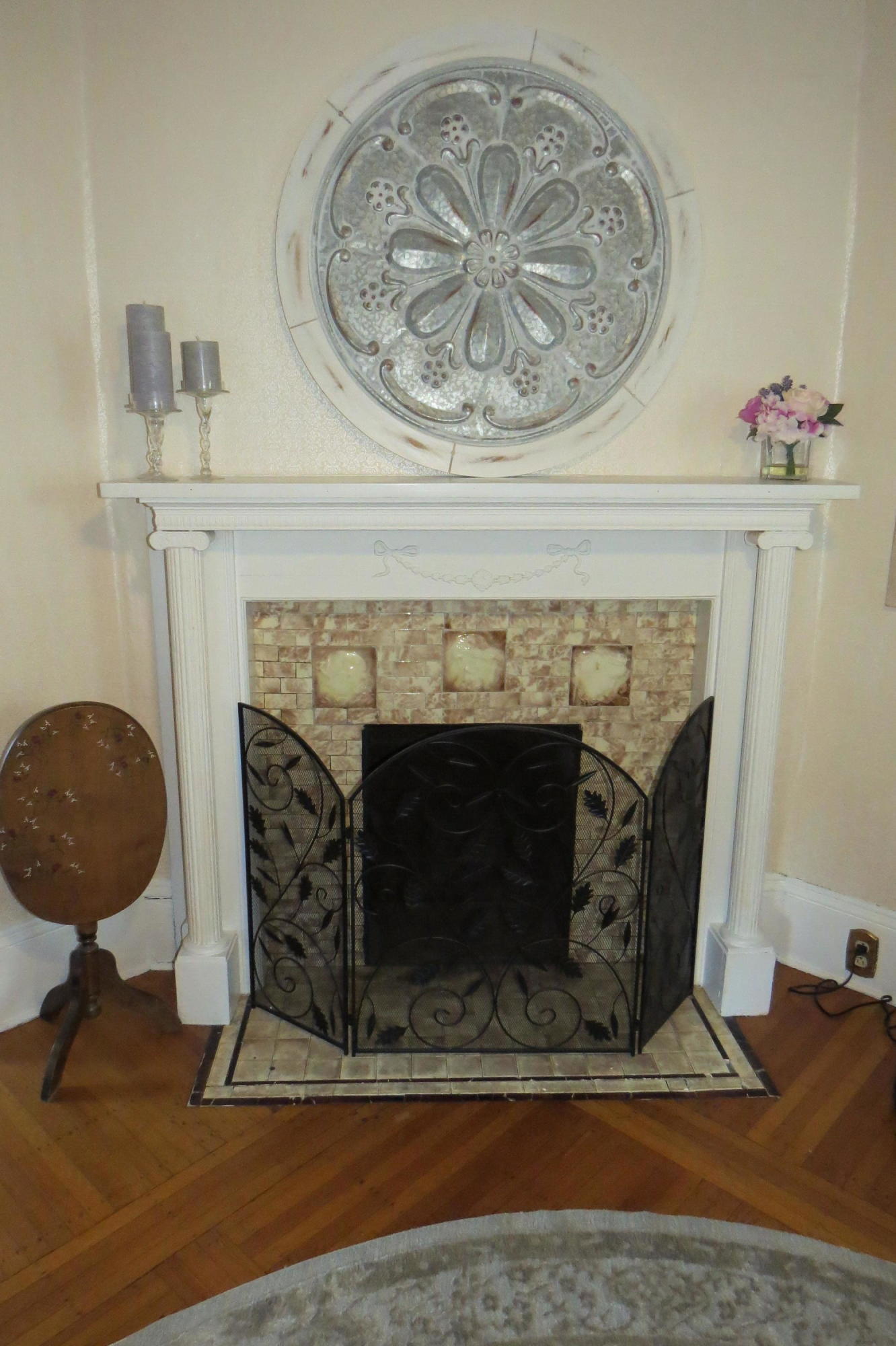 29 Crandall Street Adams, MA 01220 - Photo 7 of 61 a living room with a fireplace and a chandelier