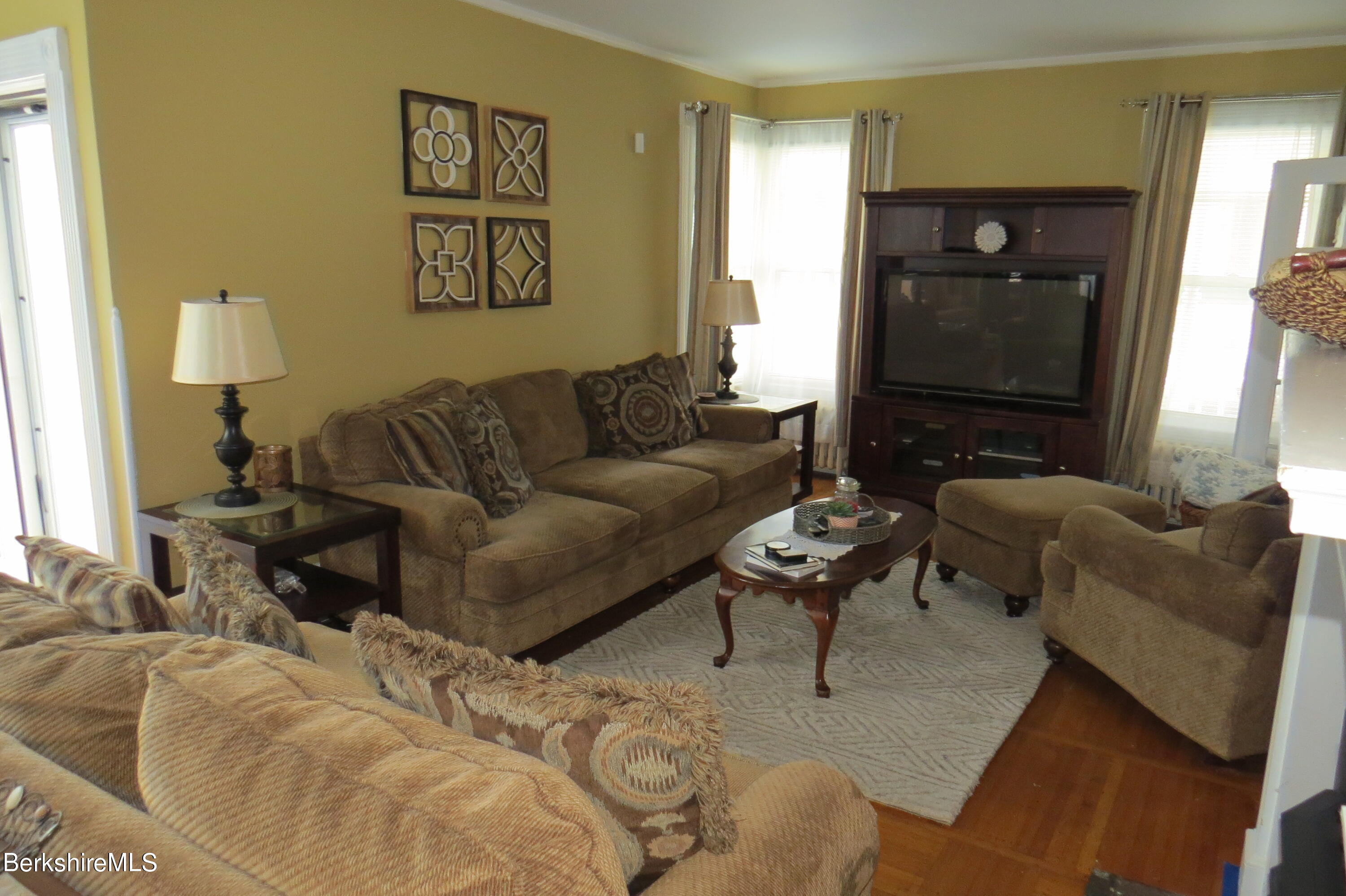 29 Crandall Street Adams, MA 01220 - Photo 8 of 61 a living room with furniture and a window