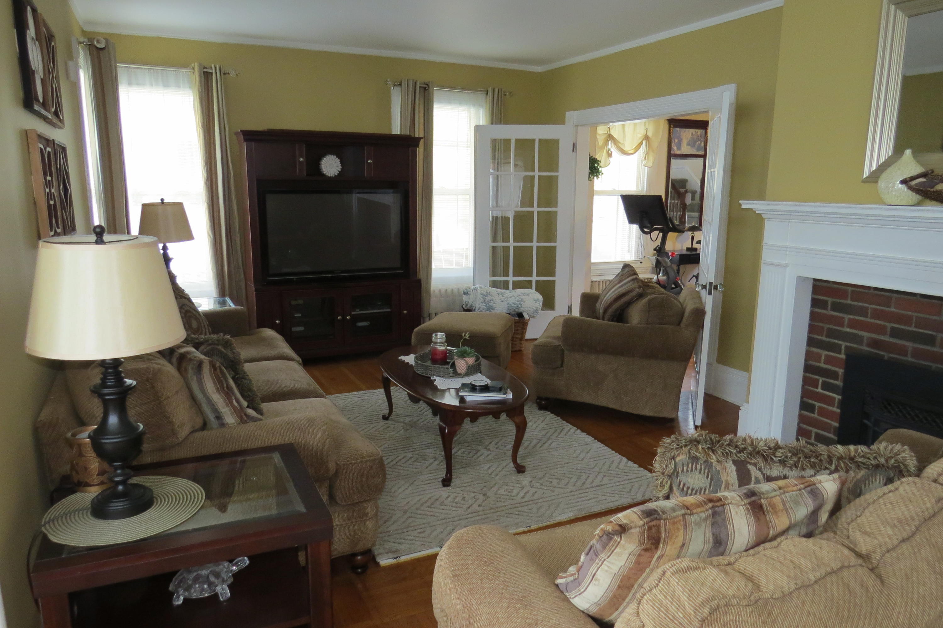 29 Crandall Street Adams, MA 01220 - Photo 10 of 61 a living room with furniture and a fireplace