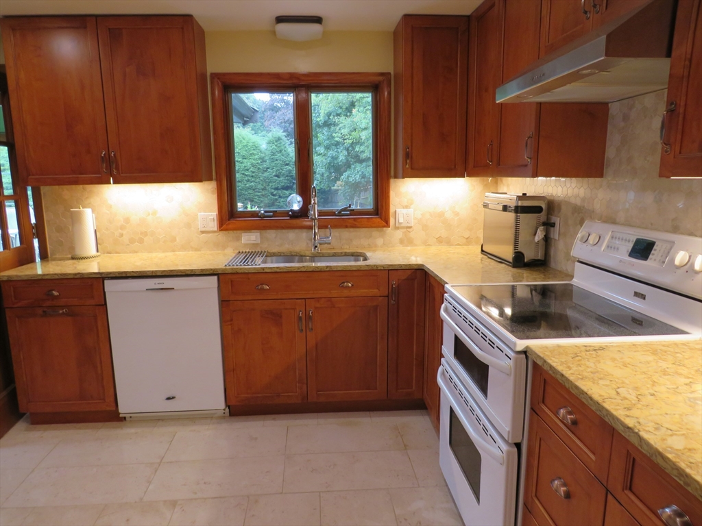 8 Talbot Road Canton, MA 02021 - Photo 12 of 41 a kitchen with granite countertop a sink and a stove
