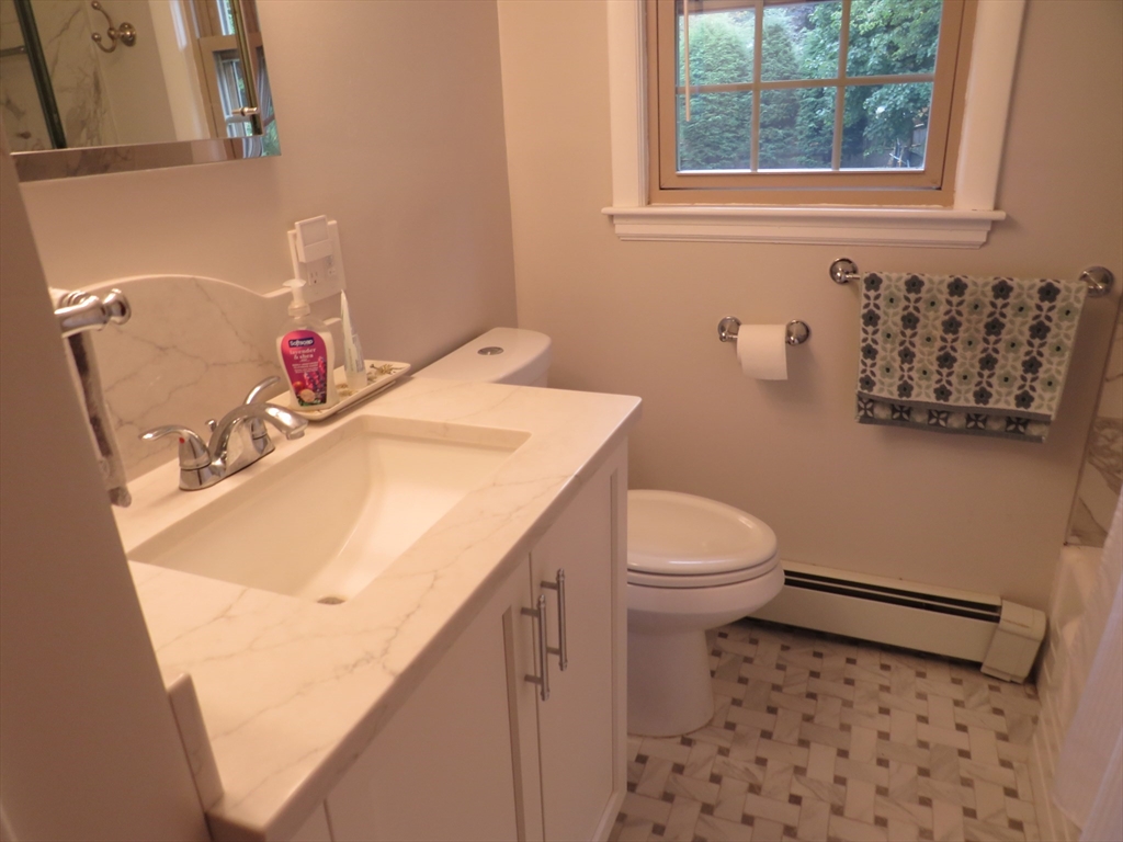 8 Talbot Road Canton, MA 02021 - Photo 14 of 41 a bathroom with a sink toilet and window
