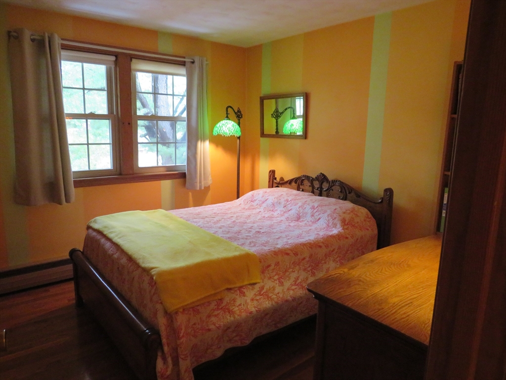 8 Talbot Road Canton, MA 02021 - Photo 16 of 41 a bed sitting in a bedroom next to a window