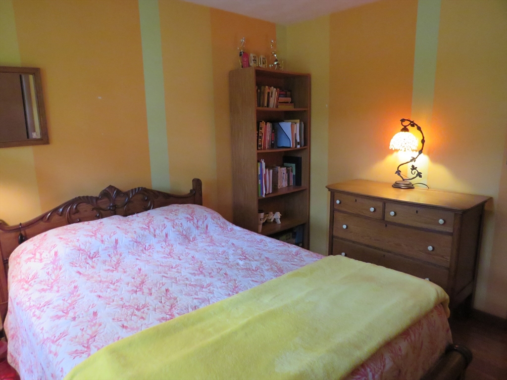 8 Talbot Road Canton, MA 02021 - Photo 17 of 41 a bedroom with a bed and a bookshelf